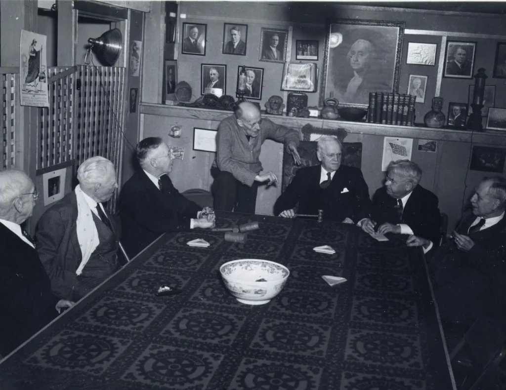 Early Rotary Board Meeting at Comely Bank Historic group of Rotary leaders seated around a table at Comely Bank.