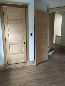 Restored doorway and wood flooring in the guest bedroom.