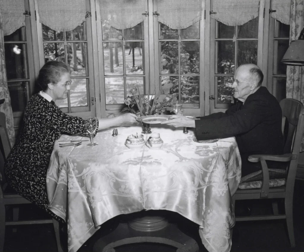Paul and Jean Harris seated at a table in the Breakfast Nook.