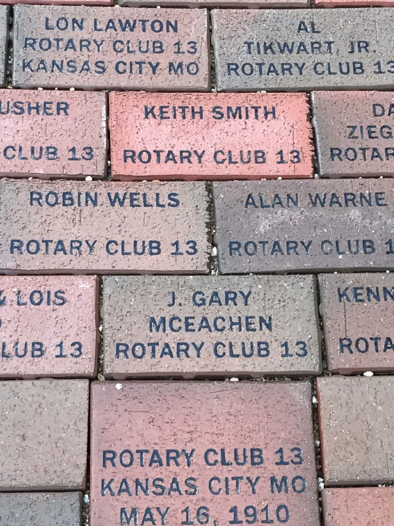 Personalized Rotary Walkway Bricks Close-up of personalized engraved bricks recognizing Rotary clubs and supporters.